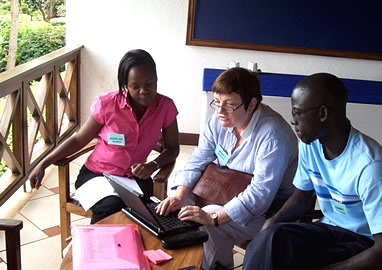 NDI staff, including NDI-Kenya Senior Resident Director Mary O'Hagan (center), meet in preparation for the workshop