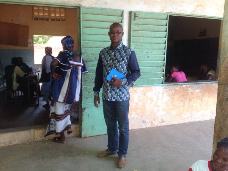 NDI staff member Michel Ouoba outside a polling station.