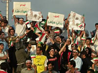 Iranians participate in a rally for presidential candidate Mustafa Moin in 2005