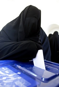 An Iranian woman votes during a recent election.