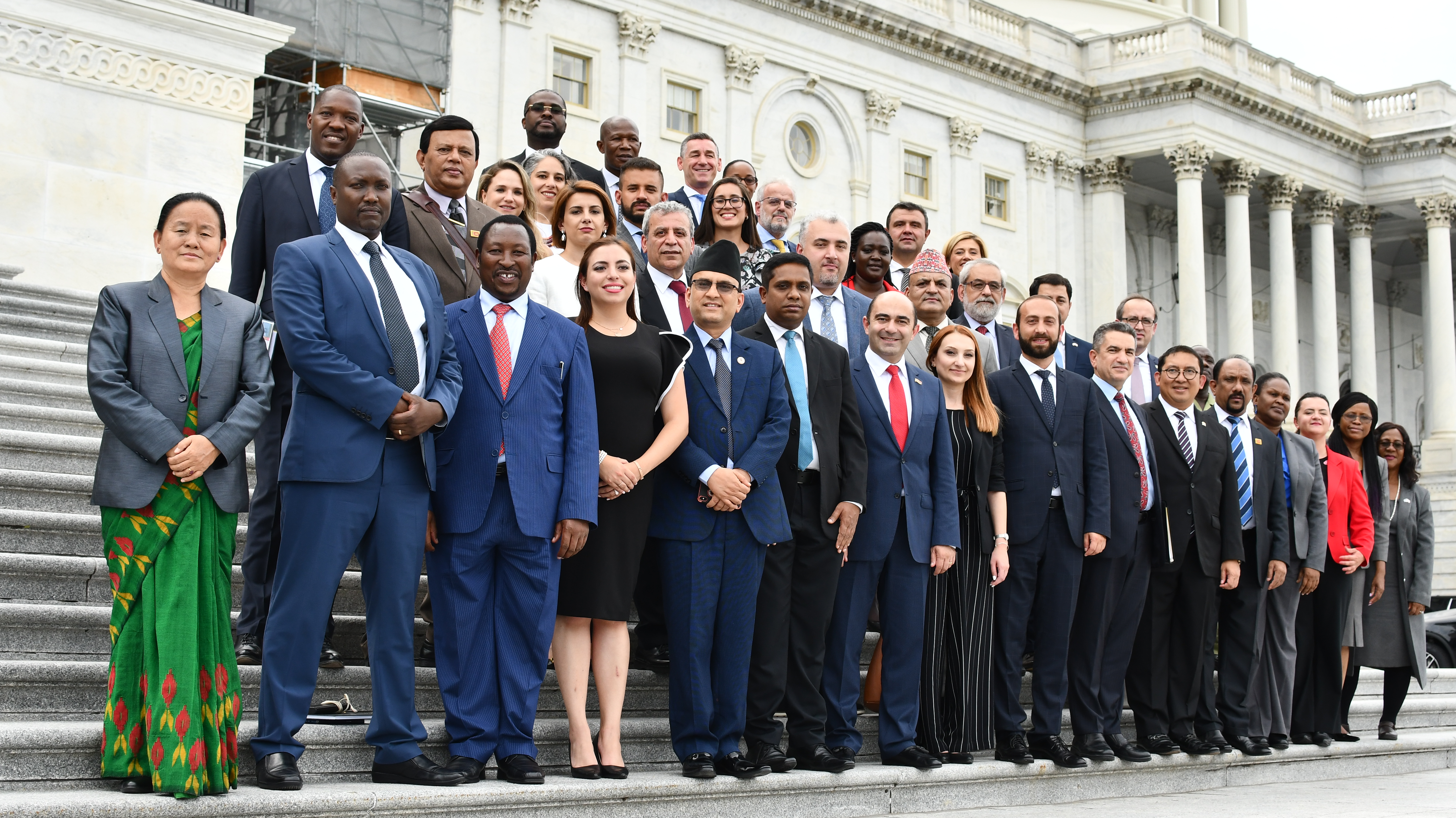 Delegates to the HDP Leadership Forum pose on the steps of the U.S. Capitol building.