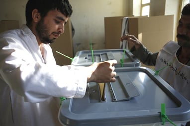 An Afghan voter casts his ballot in the 2009 election