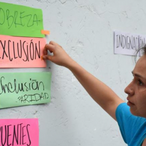 A young Guatemalan woman participates in an activity organized by civil society to reflect on the political crisis and future priorities. Credit: Pamela Saravia