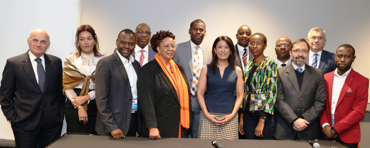 Debate moderators from nine countries with CPD vice presidential debate moderator Eliane Quijano.