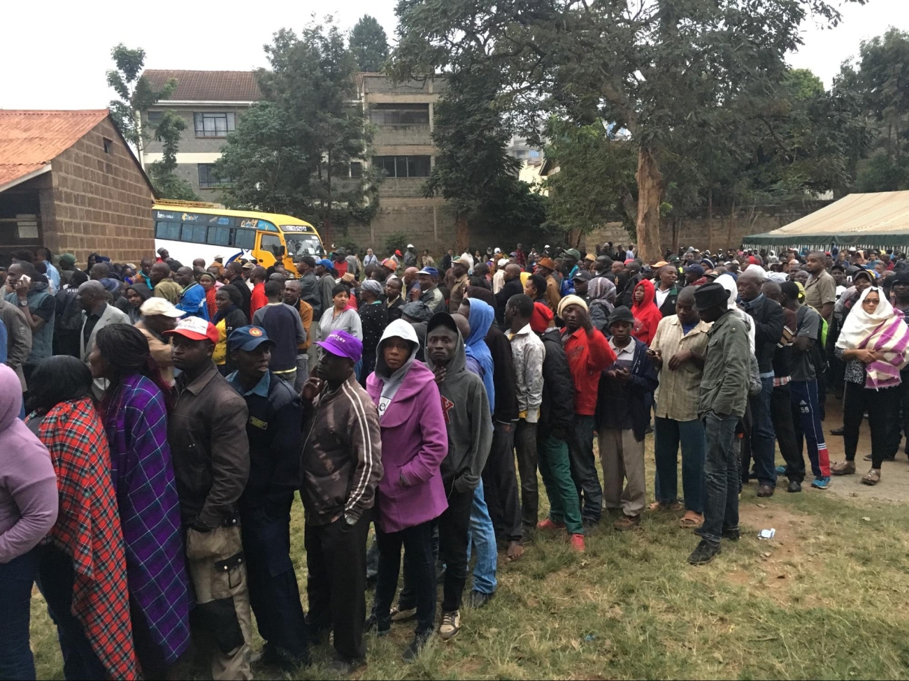 Long lines gathered outside polling stations, ready to cast their vote after waiting for hours in the dark.