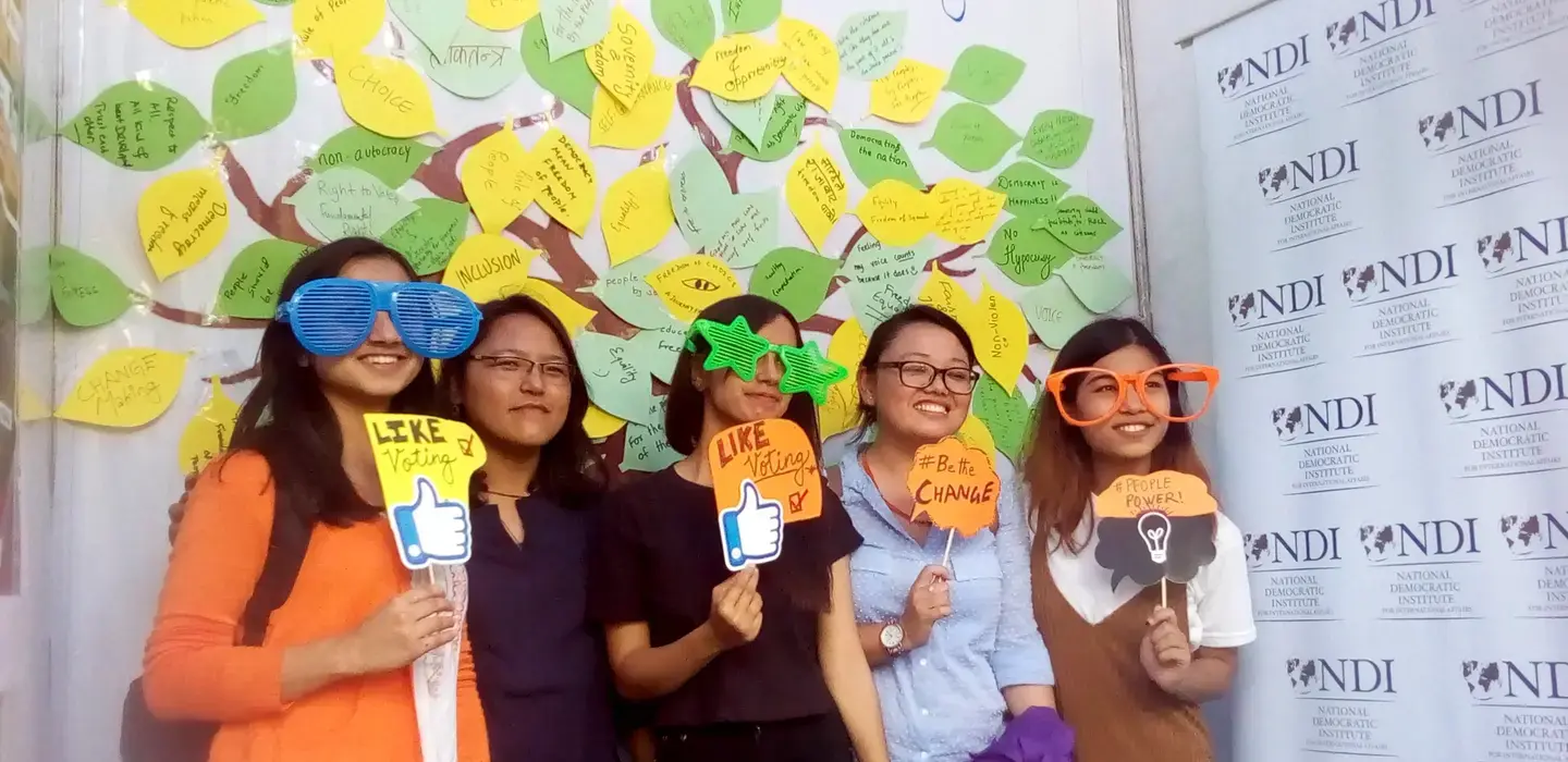 women holding like signs