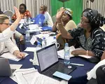 An ADCI candidate in Cocody (a district of Abidjan) and the NDI facilitator shake hands after brainstorming potential campaign messages together.