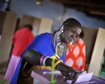 A woman in Kisumu, Kenya casts her ballot for president. See full election calendar.