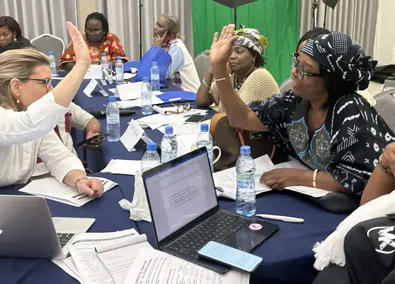 An ADCI candidate in Cocody (a district of Abidjan) and the NDI facilitator shake hands after brainstorming potential campaign messages together.