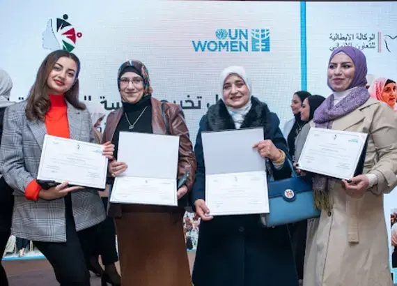 Participants with their Certificates of Graduation