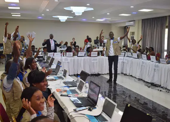 POECI supervisors celebrate the collection of final observer data on election day