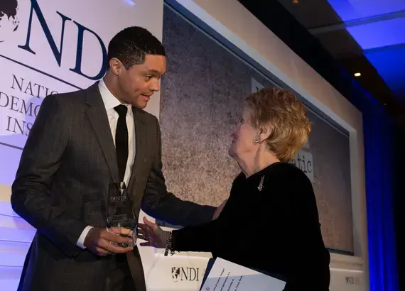Madeleine Albright presenting award to Trevor Noah