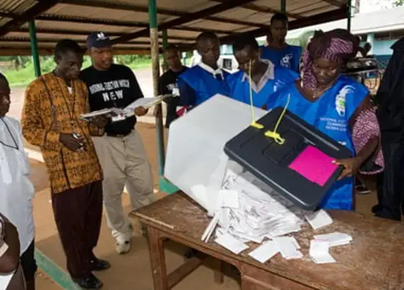 Sierra Leone domestic monitors watch vote count during 2007 elections.