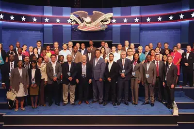 International delegates on the CPD presidential debate  stage at the Debate Visit and CPD-NDI International  Debate Symposium in October 2016 at University of  Nevada, Las Vegas in October 2016.