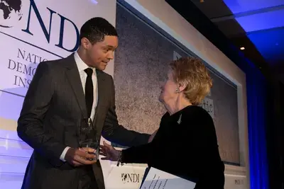 Madeleine Albright presenting award to Trevor Noah