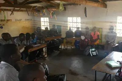 International Group Association (IGA) Accountability Club discussing health monitoring in Lilongwe Rural 