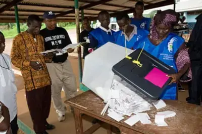 Sierra Leone domestic monitors watch vote count during 2007 elections.