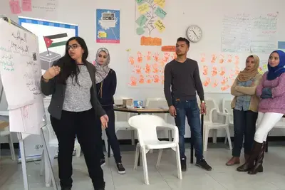 Jordanian university students participate in interactive civic education sessions as part of NDI’s “Ana Usharek” (I Participate) program. 