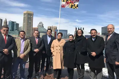 Baltimore, MD - After meeting with representatives from Safe Streets, the delegates took advantage of the good weather to pose for a photo with Maryland’s state flag before they headed to a meeting at the district office of U.S. Congressman Jamie Raskin.