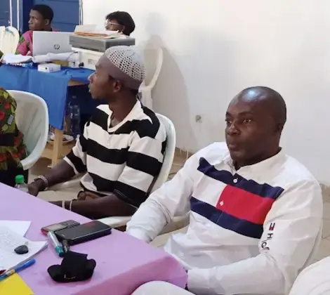 Marius, center right, participates in a workshop to share lessons learned from his community volunteering experiences.